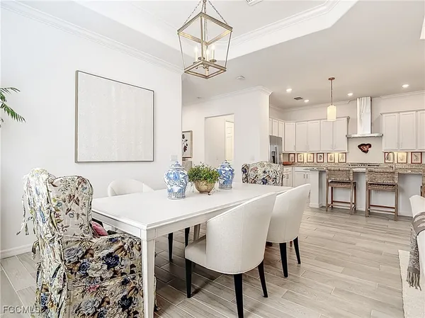 a view of a patio with couches chairs and a umbrella