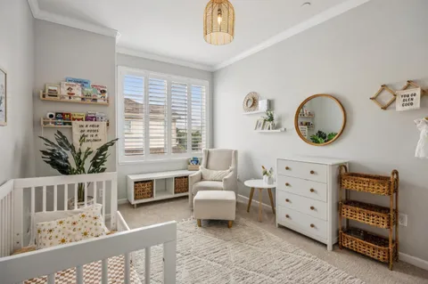 a bedroom with furniture and a window