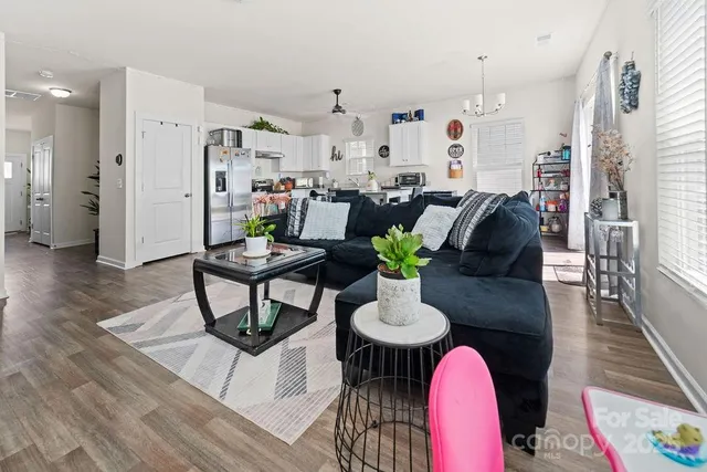 a view of kitchen with dining table and chairs