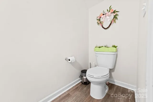 a white toilet sitting next to a sink