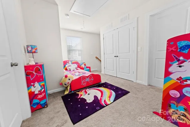 a bedroom with toys and a couch