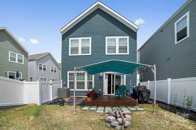 a front view of a house with a yard outdoor seating and barbeque oven