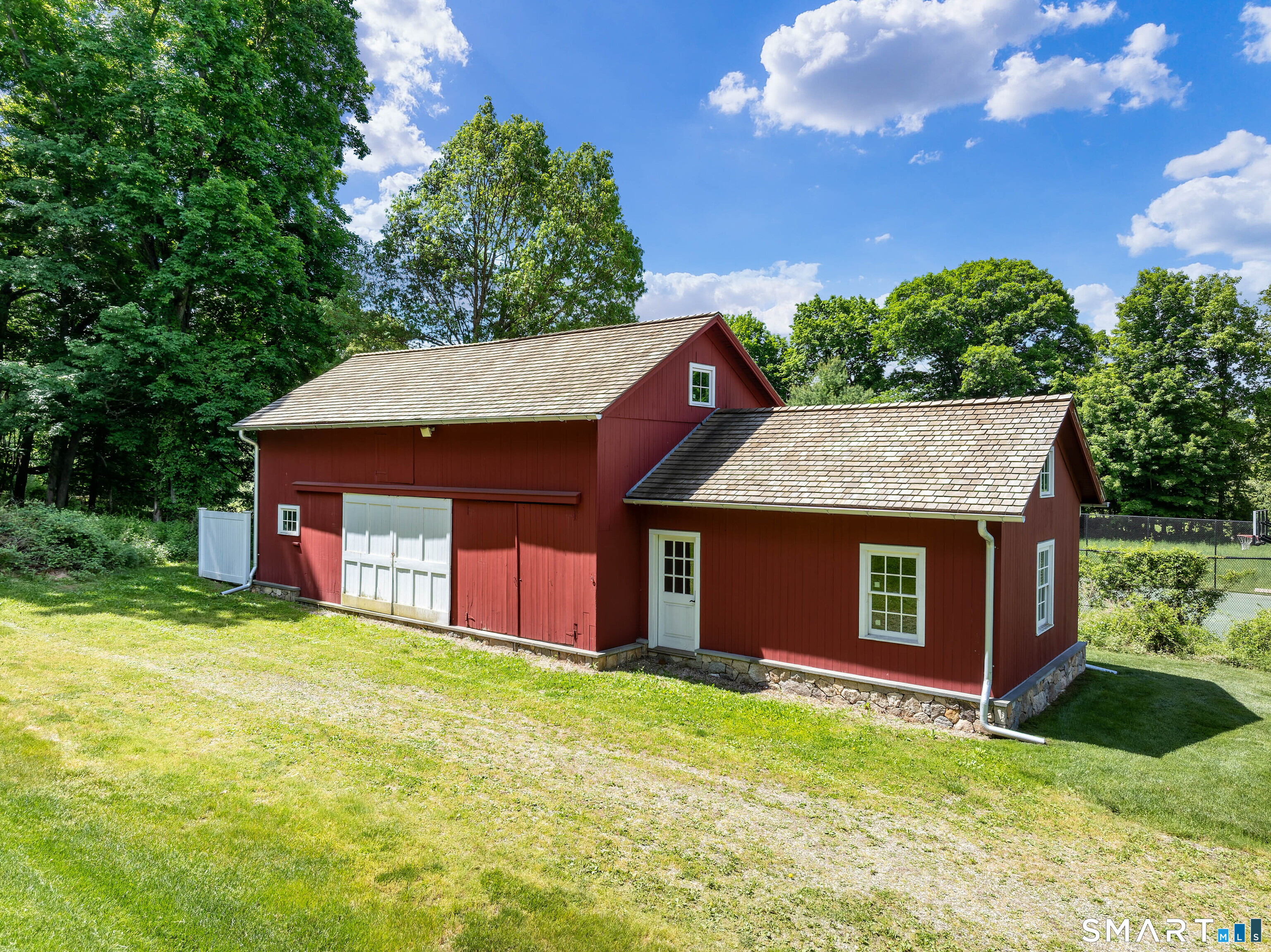 240 Umpawaug Road Redding, CT 06896 - Photo 4 of 40 The Barn, restored with electric, new foundation, new roof and original loft and framing.