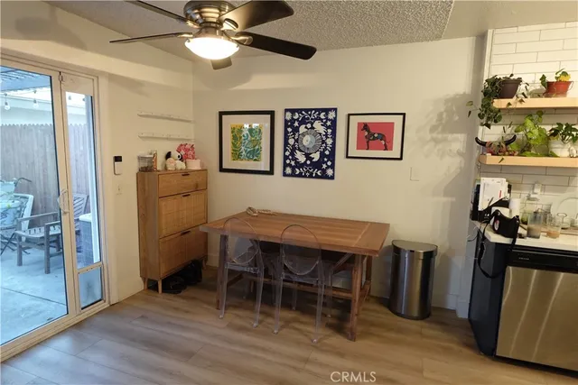 a living room with furniture rug and wooden floor