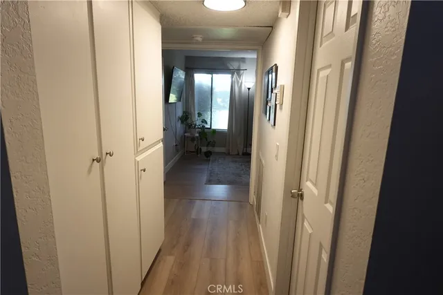 a bedroom with furniture and a flat screen tv