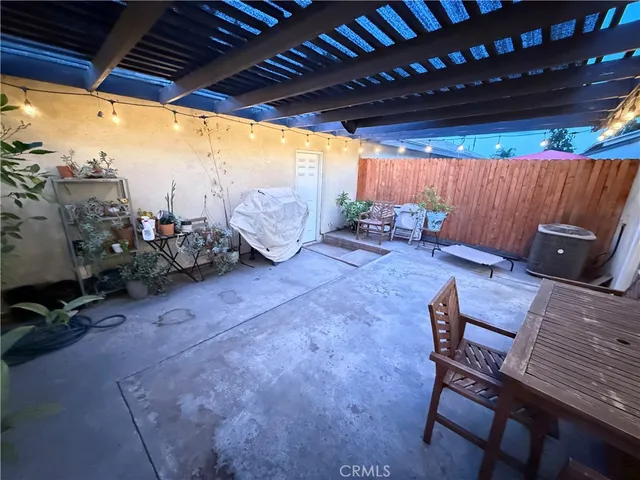 a view of a backyard with sitting area