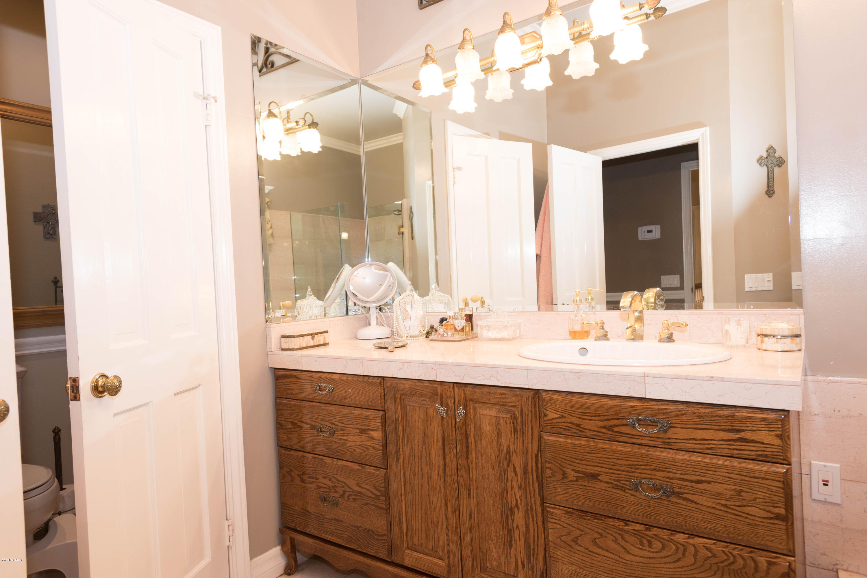 1735 Pancho Road Camarillo, CA 93012 - Photo 25 of 70 a bathroom with a sink a large mirror and a shower