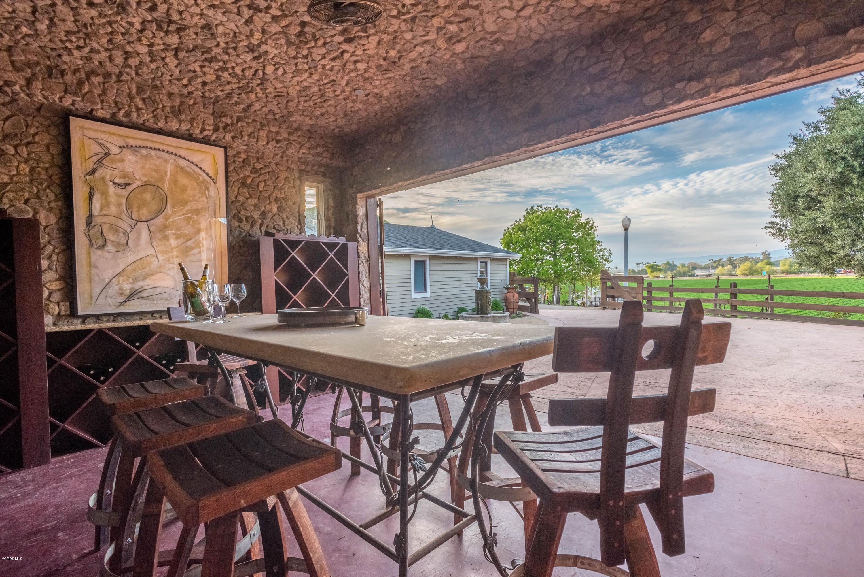 1735 Pancho Road Camarillo, CA 93012 - Photo 41 of 70 a view of a patio with table and chairs with wooden floor and fence