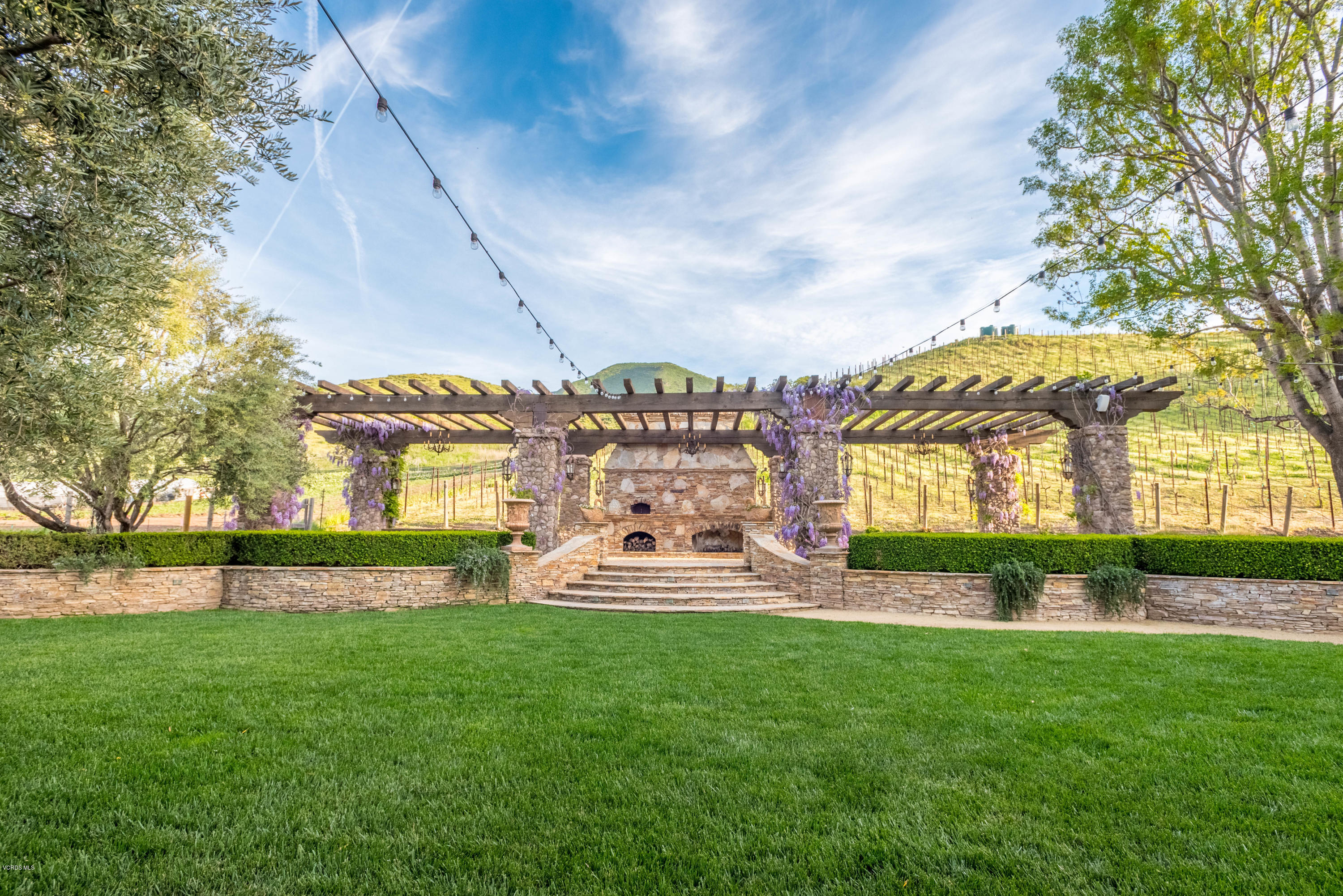 1735 Pancho Road Camarillo, CA 93012 - Photo 43 of 70 a front view of a house with garden and sitting area
