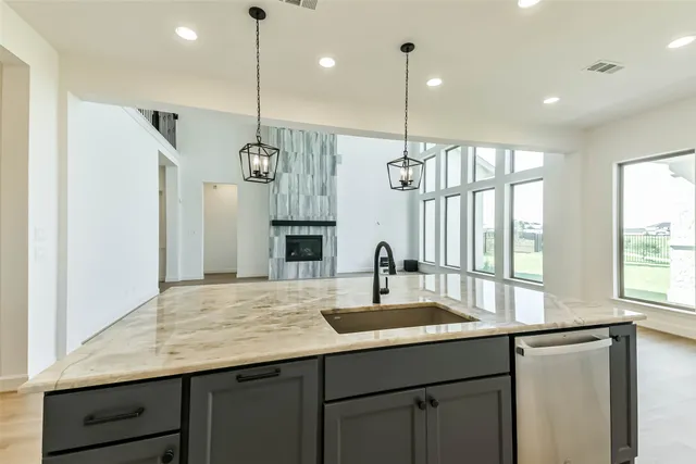 a kitchen with center island and windows