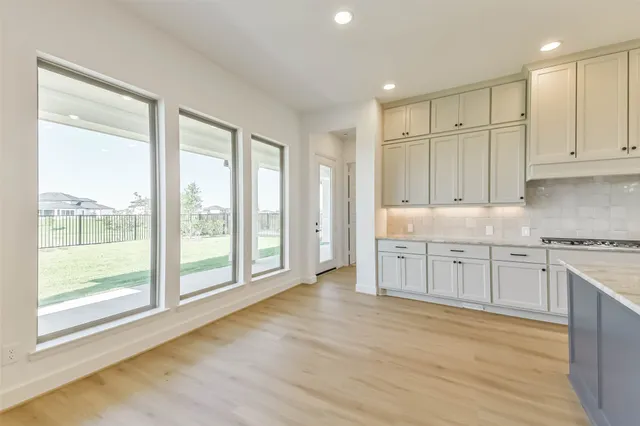 a view of a kitchen with electric appliances