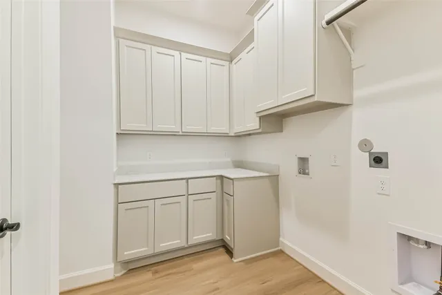 a view of cabinets and wooden floor