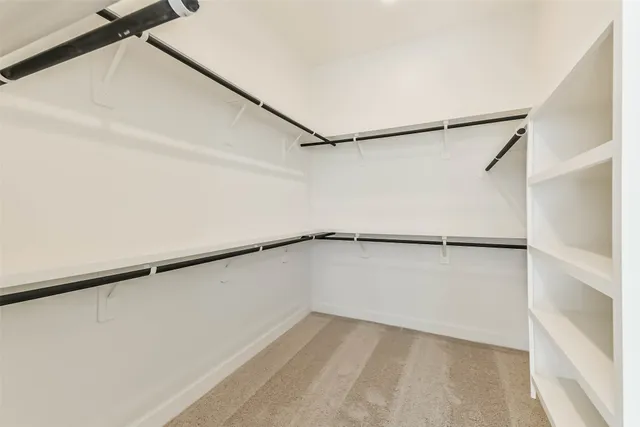 a view of an empty walk in closet