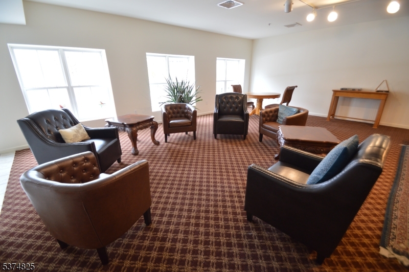 1 Jenny Lind Street, Unit 11 Netcong, NJ 07857 - Photo 7 of 24 a living room with furniture a rug a lamp and a window