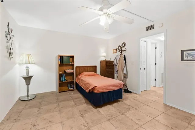 a bed room with a bed and a table