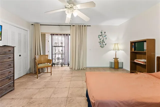 a bedroom with furniture and window