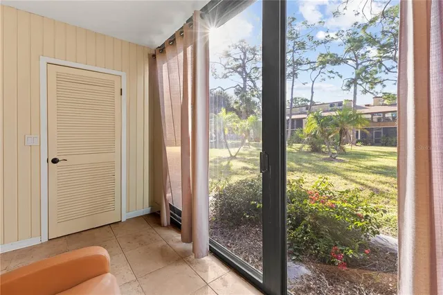 a view of a room that has a large window