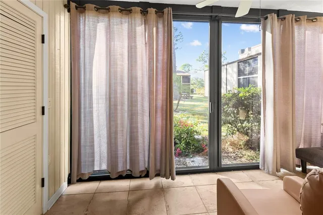 a view of a room that has a bed and a window
