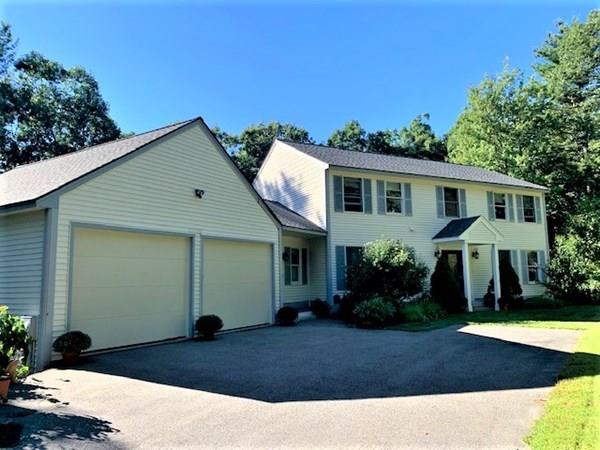 95 Stonefence Road Lunenburg, MA 01462 - Photo 1 of 41 a front view of a house with garden
