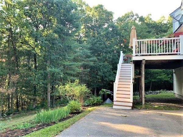 95 Stonefence Road Lunenburg, MA 01462 - Photo 12 of 41 a view of a deck with a large window and wooden fence