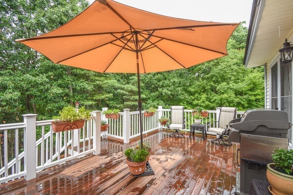 95 Stonefence Road Lunenburg, MA 01462 - Photo 13 of 41 a view of balcony with outdoor seating and wooden floor