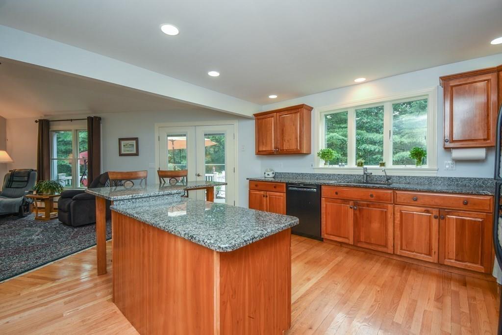 95 Stonefence Road Lunenburg, MA 01462 - Photo 15 of 41 a kitchen with stainless steel appliances granite countertop wooden cabinets a granite counter tops and a window