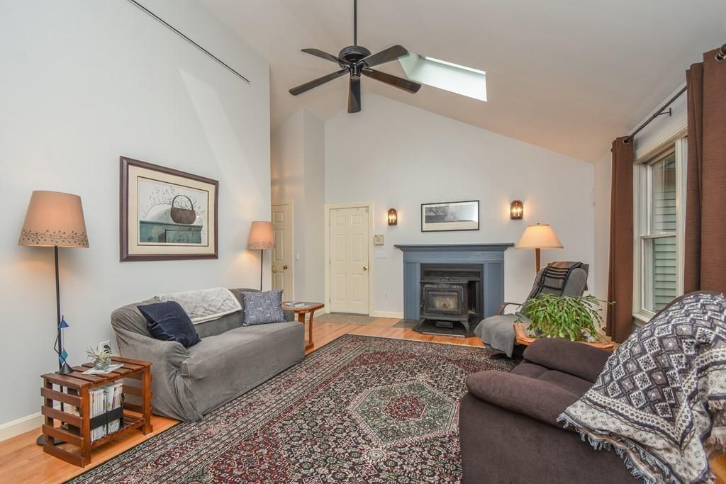 95 Stonefence Road Lunenburg, MA 01462 - Photo 18 of 41 a living room with furniture and a fireplace