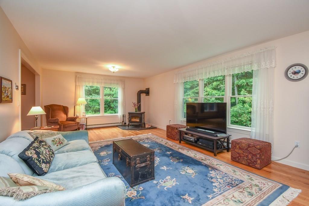 95 Stonefence Road Lunenburg, MA 01462 - Photo 20 of 41 a living room with furniture and a flat screen tv