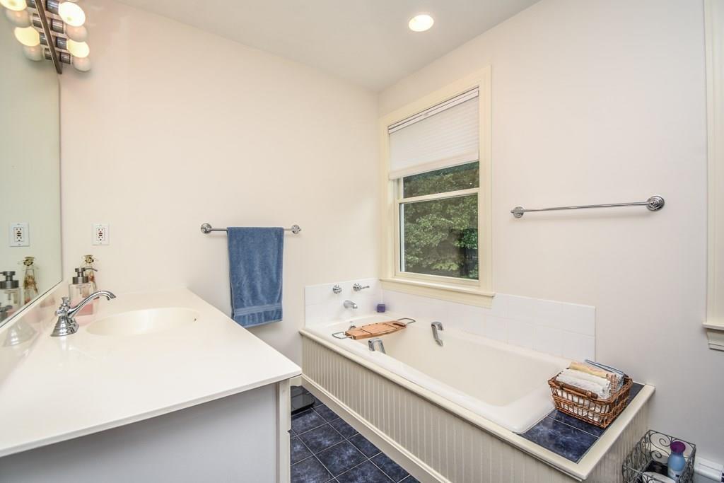95 Stonefence Road Lunenburg, MA 01462 - Photo 26 of 41 a bathroom with a sink and a bathtub