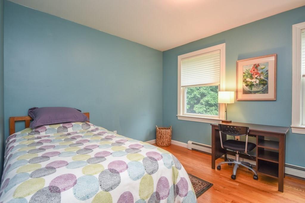 95 Stonefence Road Lunenburg, MA 01462 - Photo 29 of 41 a bedroom with a bed a table and chair