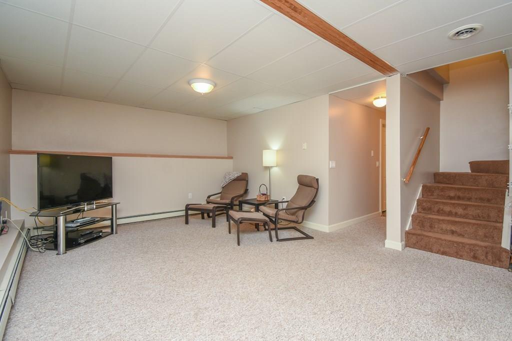 95 Stonefence Road Lunenburg, MA 01462 - Photo 32 of 41 a view of a livingroom with furniture and a flat screen tv