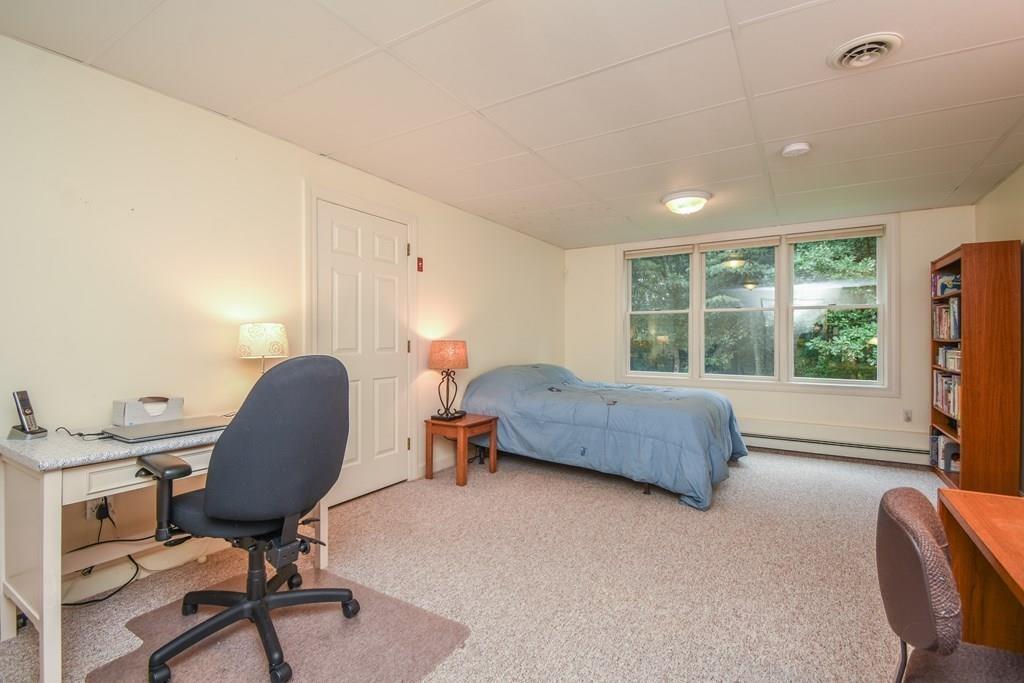 95 Stonefence Road Lunenburg, MA 01462 - Photo 35 of 41 a bedroom with furniture and a window