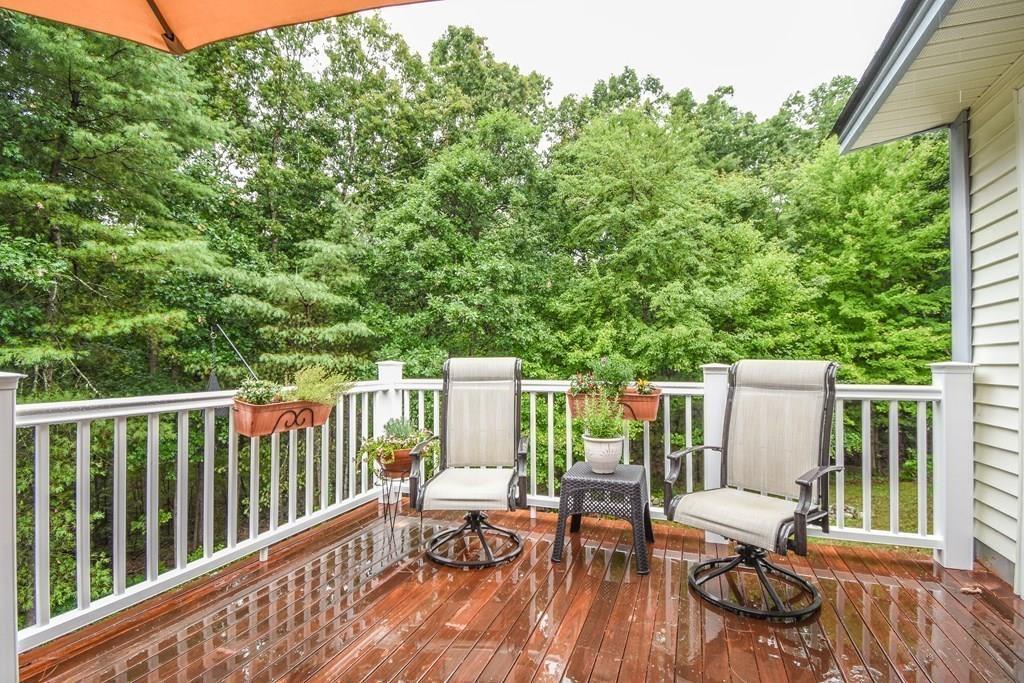 95 Stonefence Road Lunenburg, MA 01462 - Photo 38 of 41 a view of balcony with wooden floor and outdoor seating