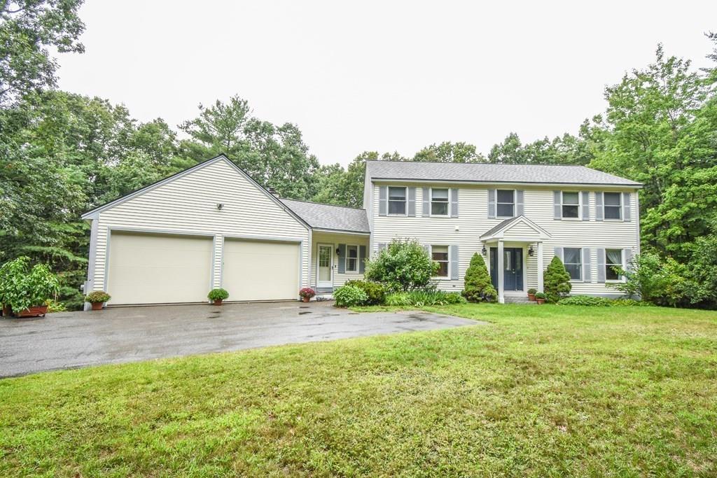 95 Stonefence Road Lunenburg, MA 01462 - Photo 5 of 41 a view of a house with a yard and potted plants