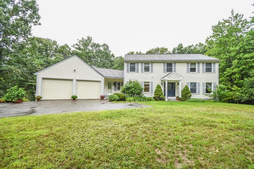95 Stonefence Road Lunenburg, MA 01462 - Photo 7 of 41 a view of a house with a big yard and large trees
