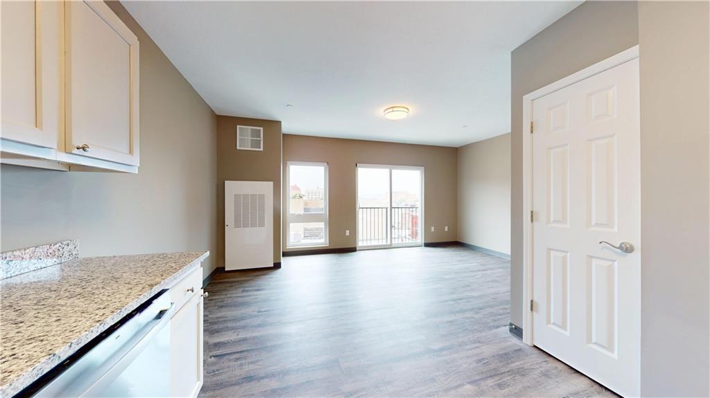 1450 Fifth Avenue, Unit 202 Pittsburgh, PA 15219 - Photo 18 of 20 an empty room with wooden floor and windows
