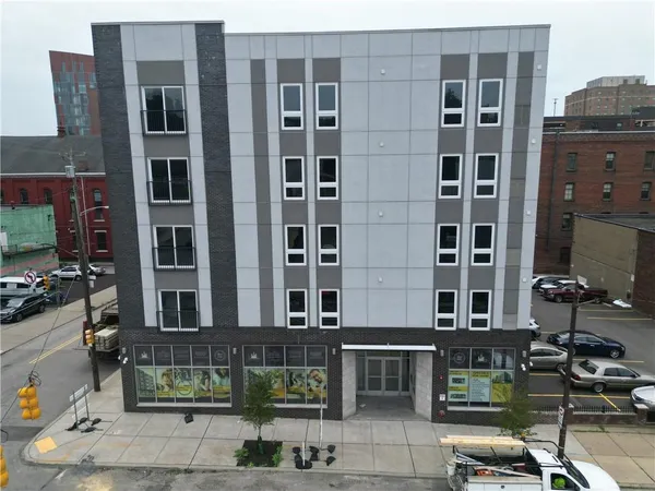 a front view of a building with street view