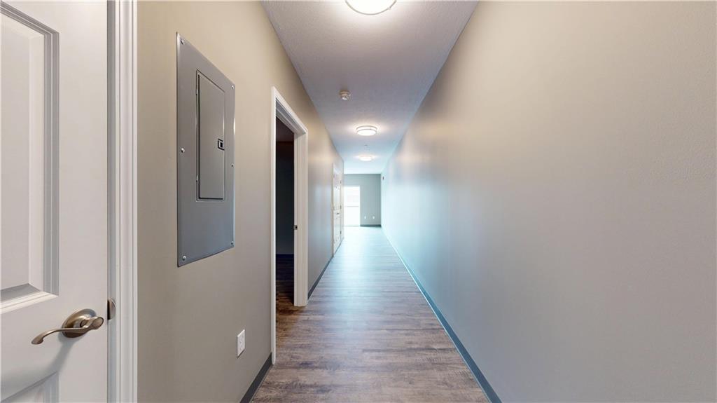 1450 Fifth Avenue, Unit 202 Pittsburgh, PA 15219 - Photo 5 of 20 a view of a hallway with wooden floor