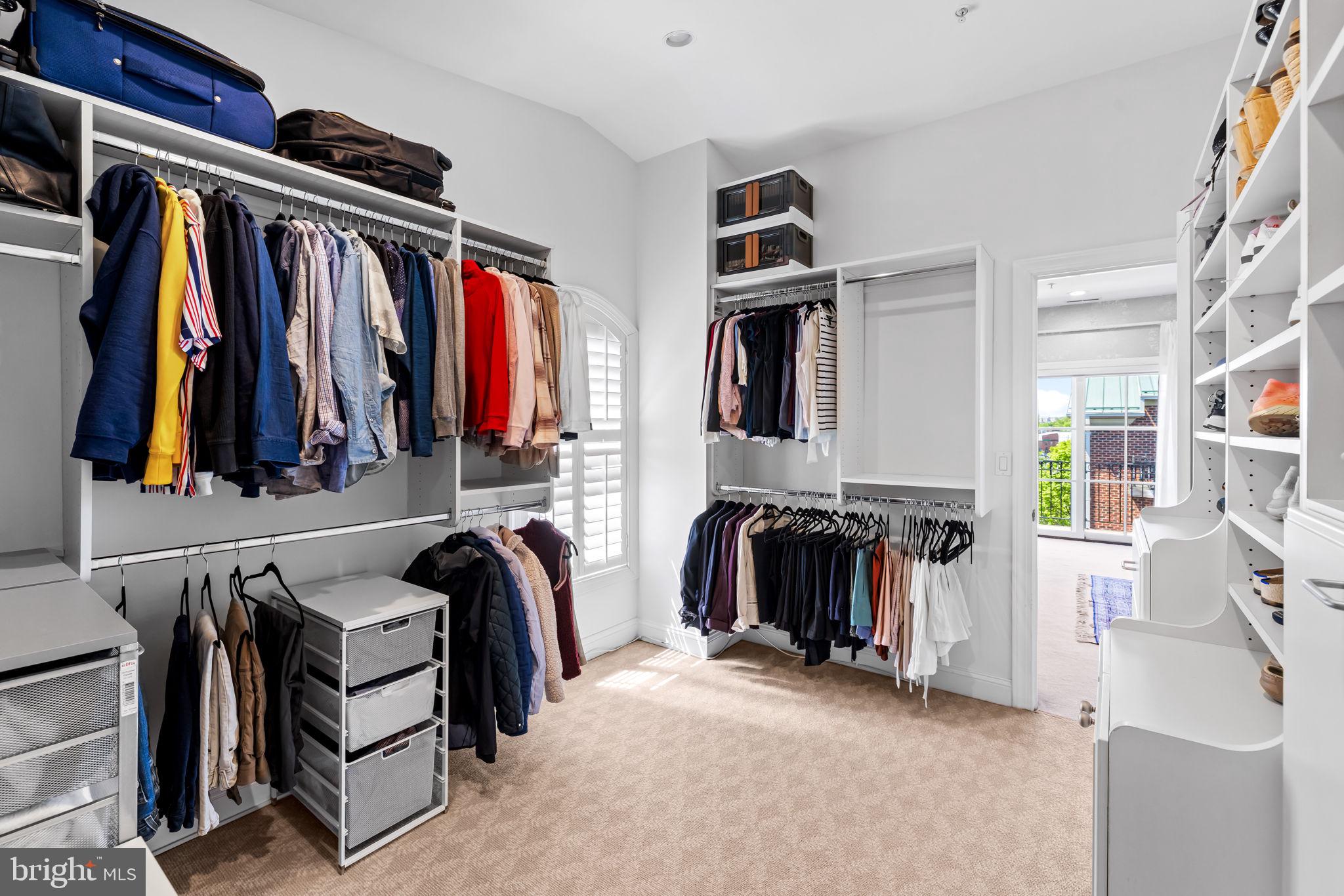 2331 Boston Street, Unit 1 Baltimore, MD 21224 - Photo 53 of 74 a view of walk in closet with clothes and shoes