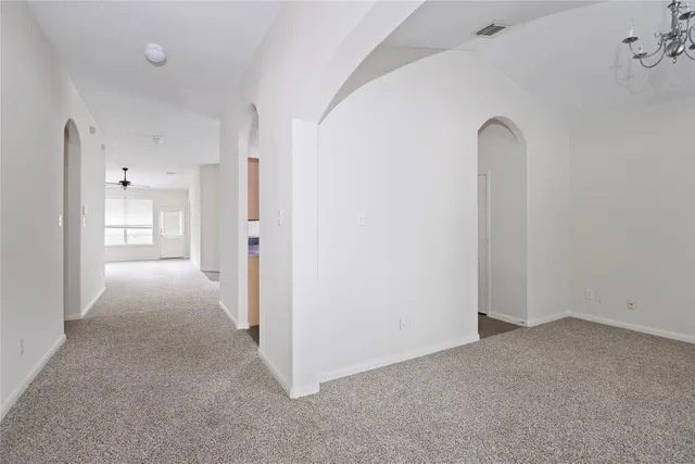 a view of a room that has a grey walls