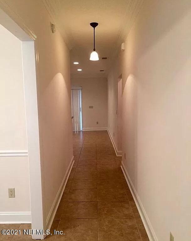 2346 Somerset Road Jacksonville, FL 32210 - Photo 13 of 23 a view of a hallway with a white walls
