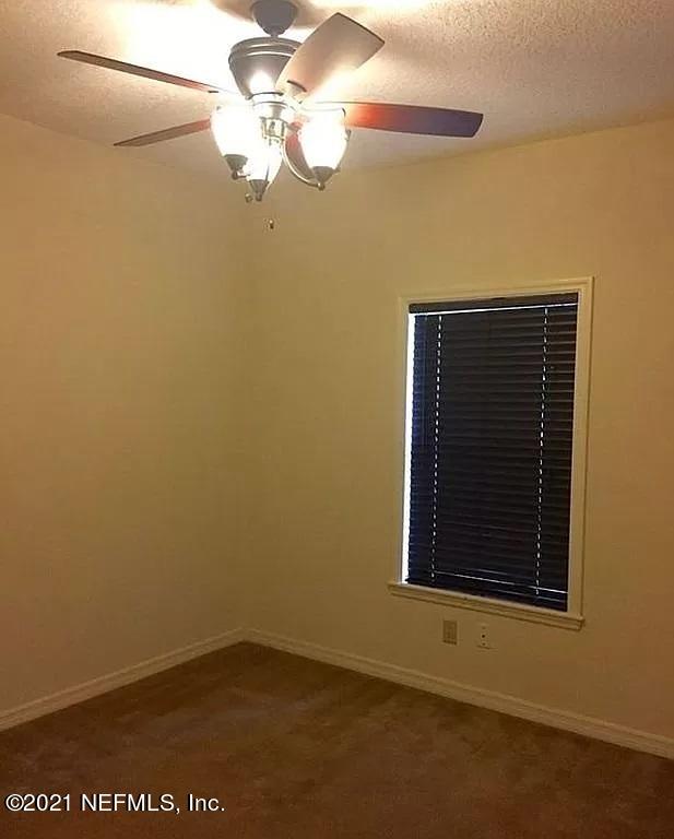 2346 Somerset Road Jacksonville, FL 32210 - Photo 14 of 23 a view of empty room with window