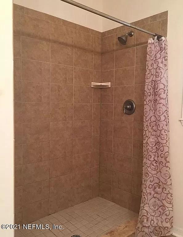 2346 Somerset Road Jacksonville, FL 32210 - Photo 17 of 23 a bathroom with a shower