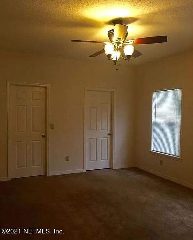 2346 Somerset Road Jacksonville, FL 32210 - Photo 19 of 23 a view of a livingroom with a chandelier fan