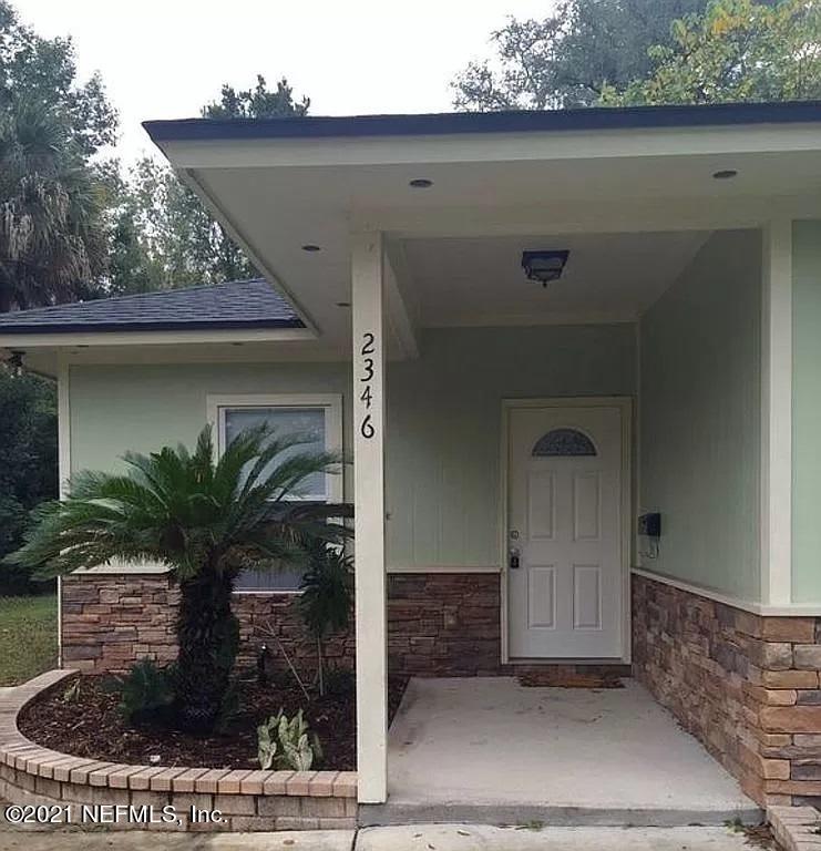 2346 Somerset Road Jacksonville, FL 32210 - Photo 22 of 23 a view of a house with a potted plant