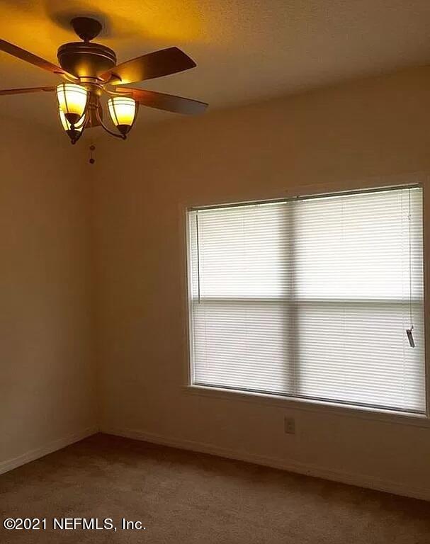 2346 Somerset Road Jacksonville, FL 32210 - Photo 8 of 23 a view of an empty room with a window