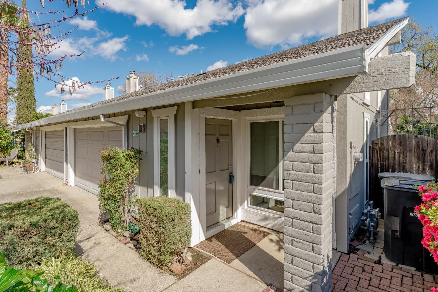 a view of a house with sitting area and garden