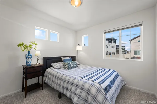 a bedroom that has a bed and a table in it