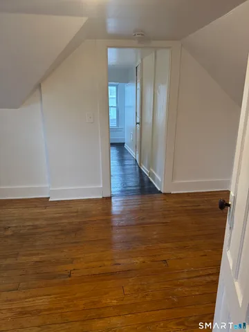 a view of room and hardwood floor