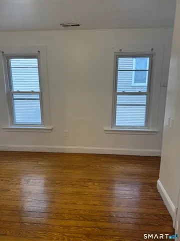 a view of an ocean & mountain view in closet